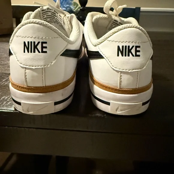 Nike boys / “fits ladies size 7 “White and Black Sneakers with Gold Accents - Picture 2 of 7
